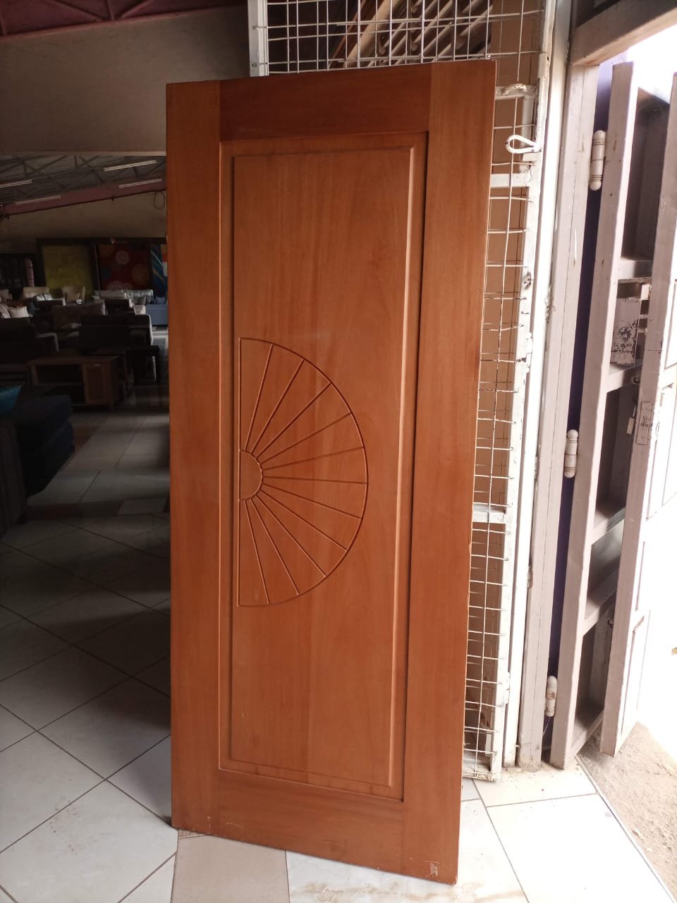 Single Panel Wooden Door With Sunburst Design